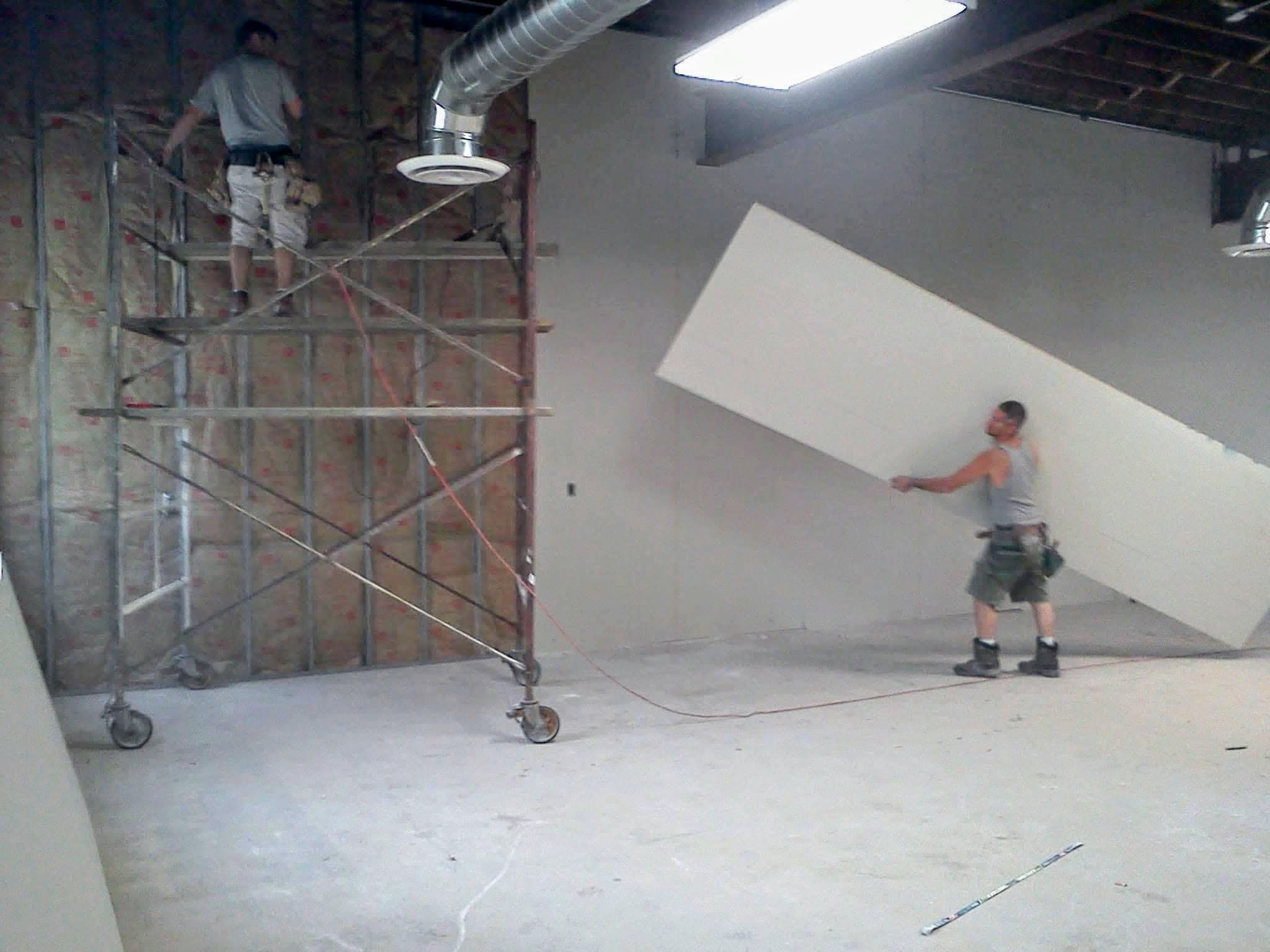TDM drywall contractor crew completing professional interior wall work