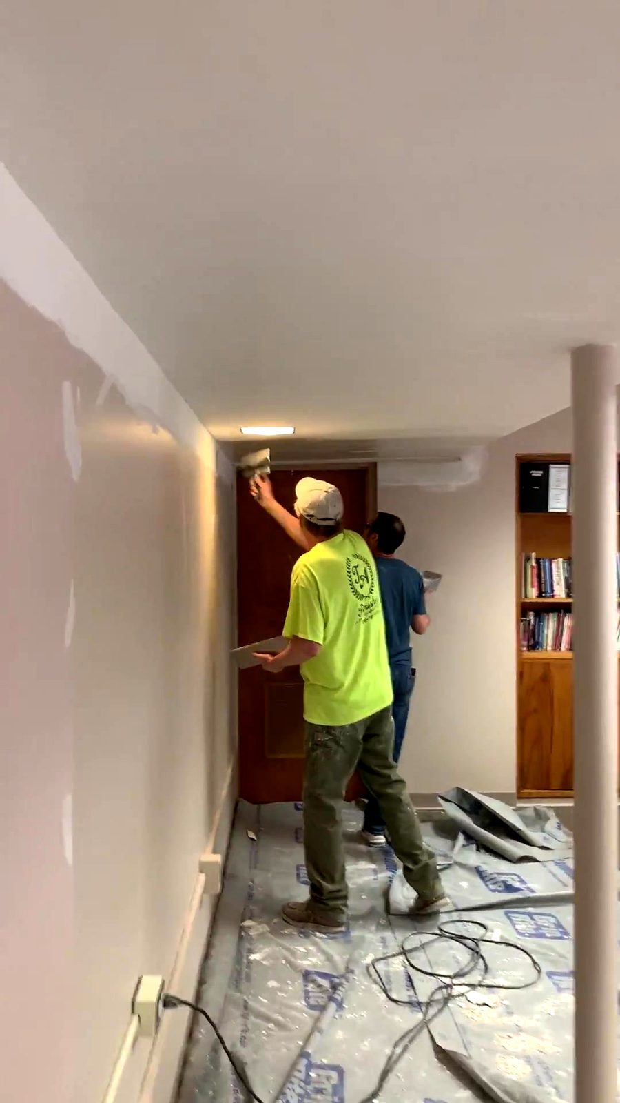 TDM Drywall crew finishing a wall on site