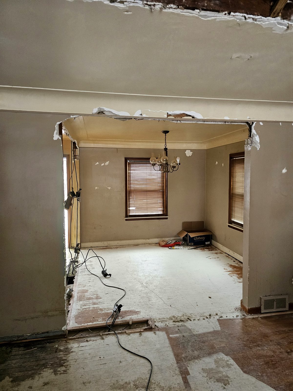 Cracked plaster repaired and skim coated by TDM Drywall