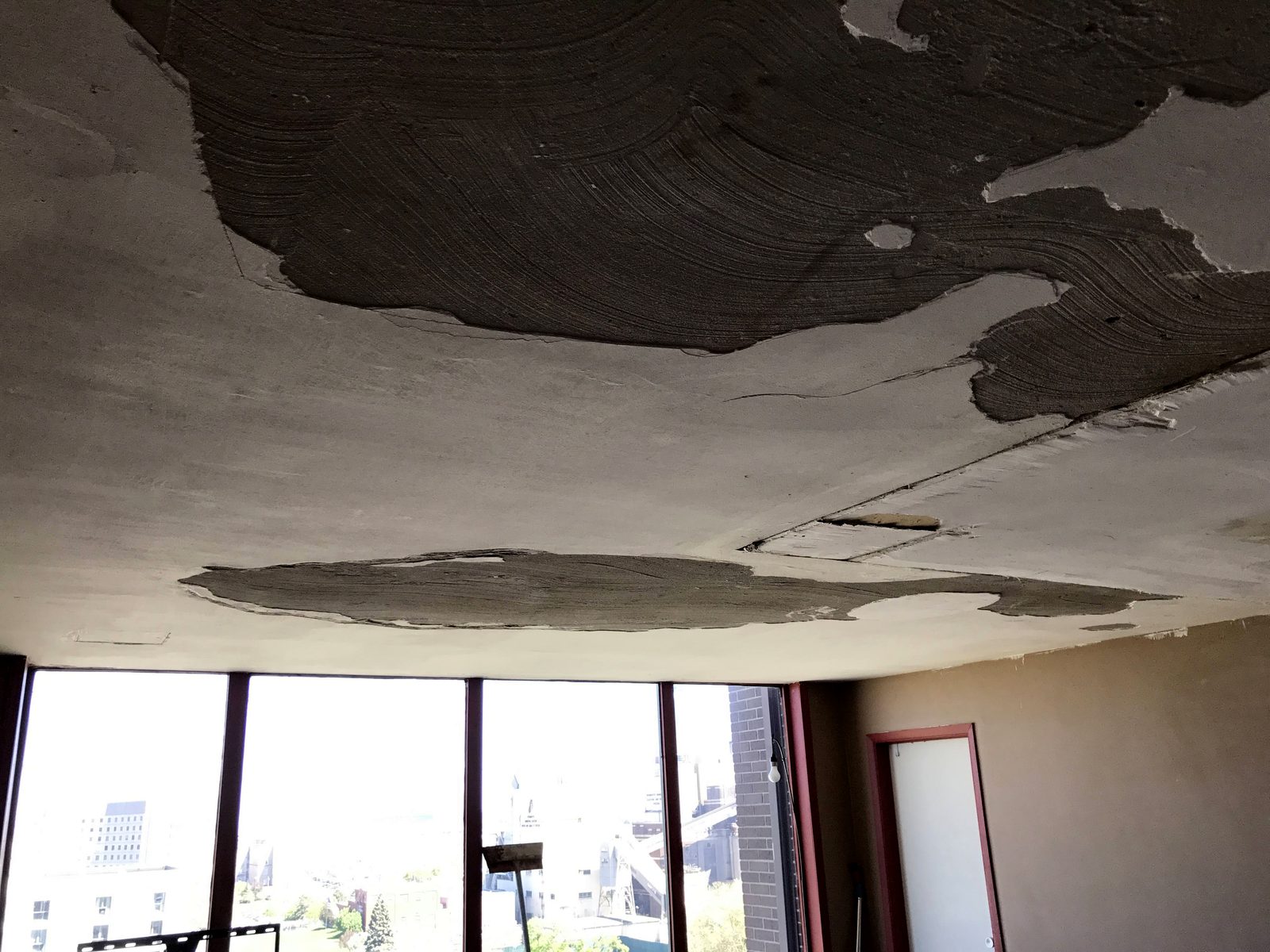 Water-damaged ceiling opened up and prepared for drywall repair by TDM Drywall