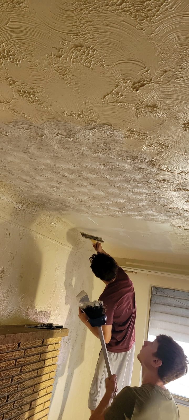 Damaged ceiling material cut back to sound framing by TDM Drywall