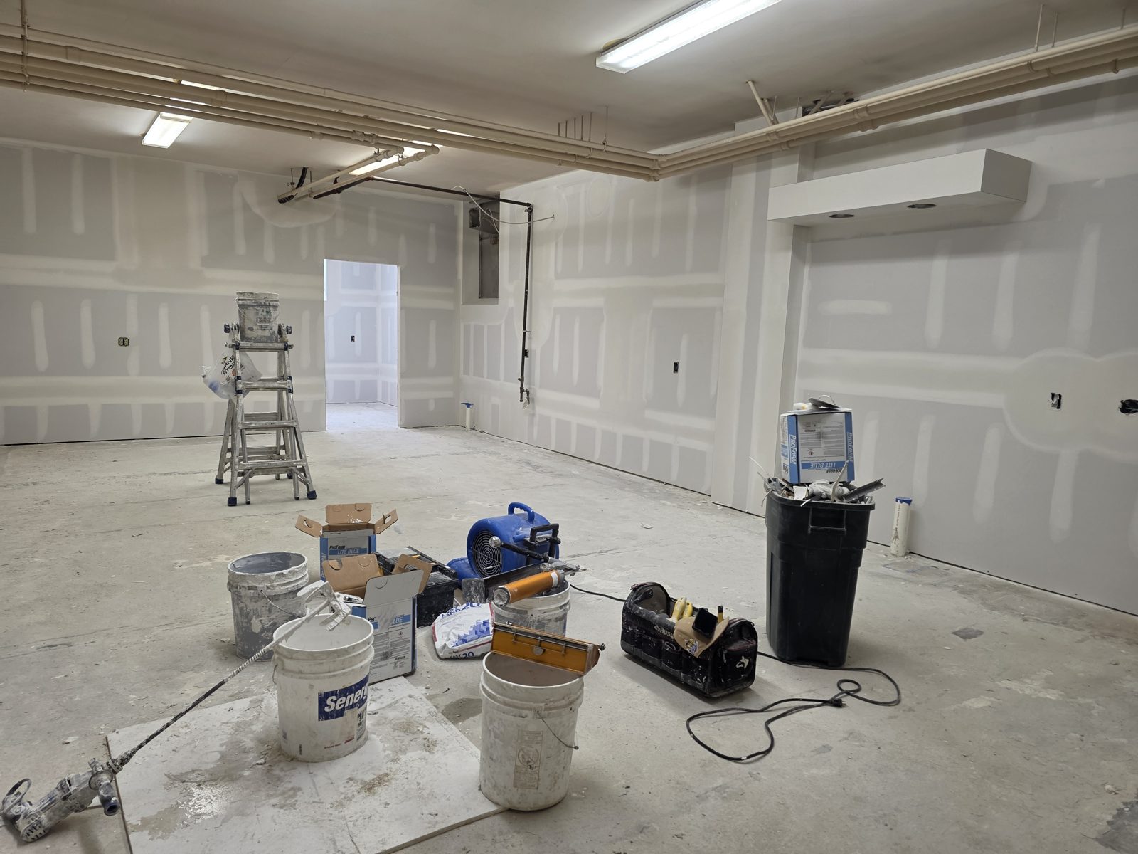Large room with new drywall hung and taped by TDM Drywall in Monroe, MI